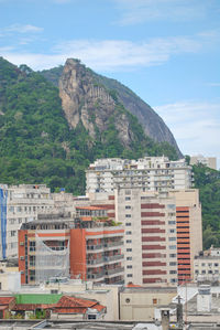 Buildings in city against sky