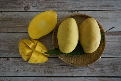 High angle view of fruits on wooden table