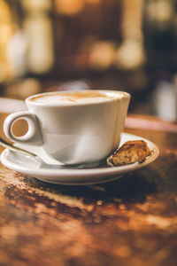 Close-up of coffee cup on table