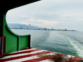 Scenic view of sea and buildings against sky