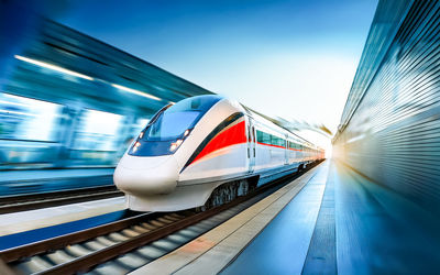Modern high-speed train enters a station, ai generates