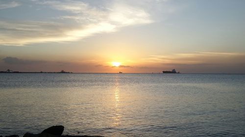 Scenic view of sea at sunset