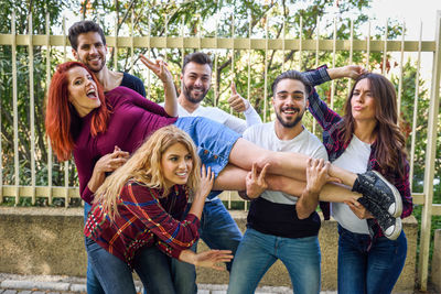 Portrait of happy friends at public park