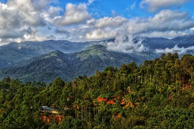 Scenic view of waterfall against sky
