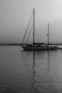 Sailboat on sea against clear sky