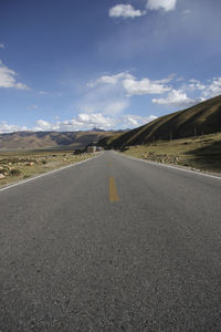 Surface level of empty road against sky