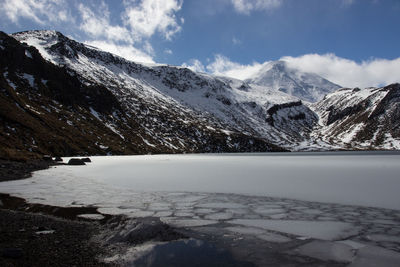 The frozen upper tama lake on the tama lakes/ tongariro northern circuit hiking track, new zealand.