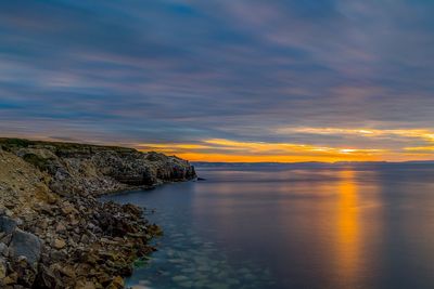 Scenic view of sea against sky at sunset