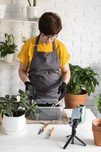 Boy watering plants