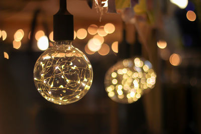 Close-up of illuminated light bulb