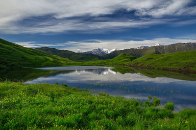 Scenic view of lake and mountains against sky. lake in the mountains