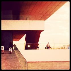 Woman standing against wall