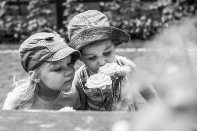 Girls smelling flowers