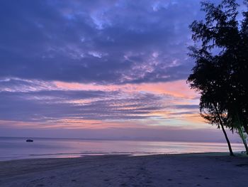 Scenic view of beach against sky during sunset