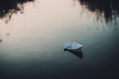 High angle view of boat floating on lake