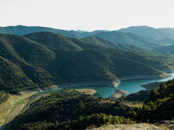 High angle view of trees and mountains against sky