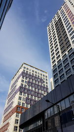 Low angle view of modern buildings against sky