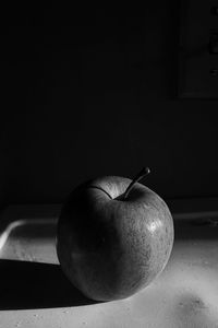Close-up of apple on table at home