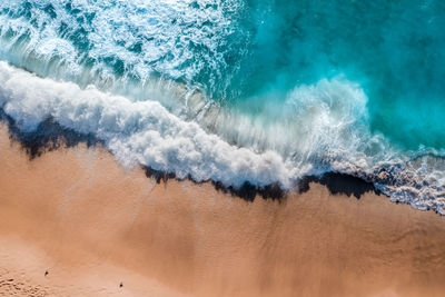 High angle view of waves on beach