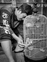 Midsection of man and woman in wicker basket