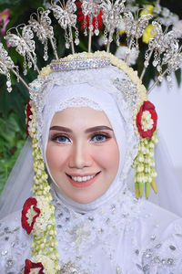 Portrait of a smiling young woman, indonesian javanese traditional wedding