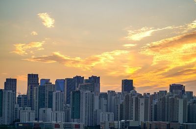 View of skyscrapers at sunset