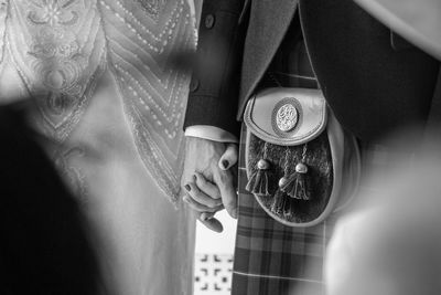 Close-up of woman holding umbrella