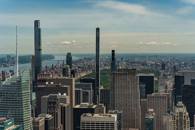 Scenic view of central park with cigarette towers in front