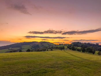 Scenic view of landscape against sky during sunset