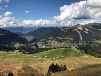 Scenic view of landscape and mountains against sky