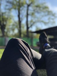 Low section of person resting in park