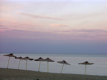 Scenic view of beach against sky during sunset