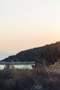Scenic view of sea against clear sky during sunset