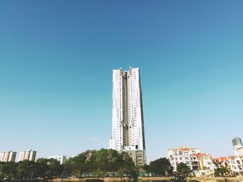 Low angle view of buildings against blue sky