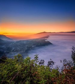 Scenic view of sea against sky during sunrise