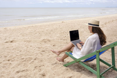 Woman sitting on beach