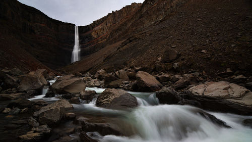 Scenic view of stream flowing through rocks