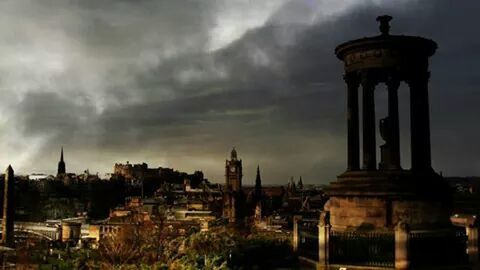 Silhouette of fort against cloudy sky