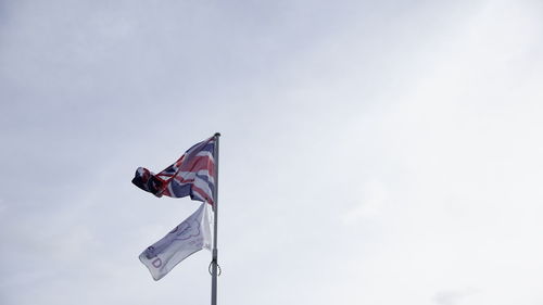 Low angle view of flag against sky