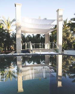 Gazebo by trees against sky