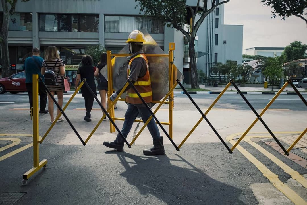 architecture, built structure, building exterior, men, city, real people, street, group of people, full length, day, nature, people, occupation, sunlight, construction industry, working, road, group, protection, outdoors