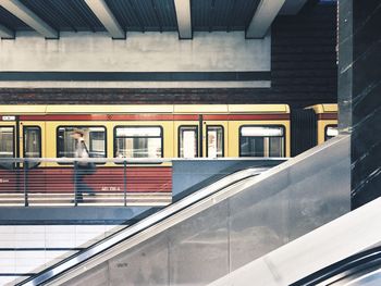 Man walking at railroad station platform