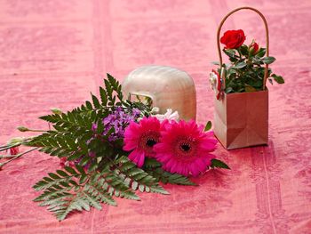 Close-up of pink flower vase on table