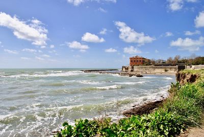 Scenic view of sea against cloudy sky