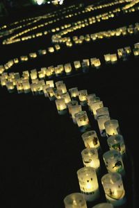 Close-up of illuminated lamp at night