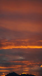 Scenic view of dramatic sky during sunset