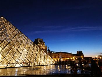 Reflection of illuminated buildings in water