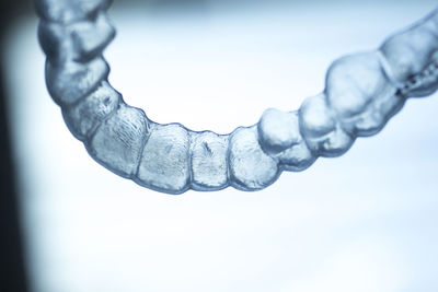 Close-up of braces against white background