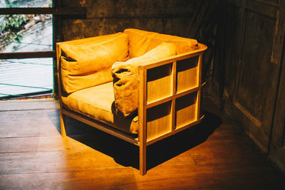Yellow sofa on floor at home