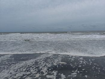 Scenic view of beach against sky